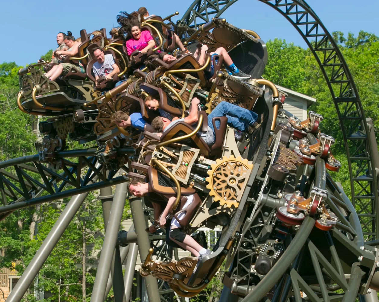 a roller coaster with several people riding it