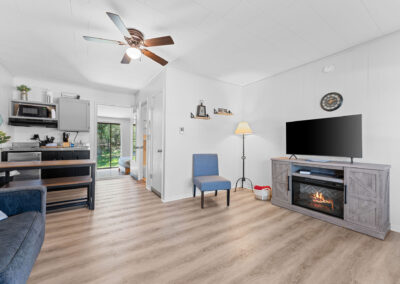 a living room filled with furniture and a flat screen tv