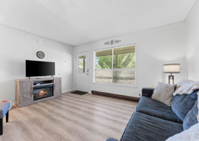 a living room filled with furniture and a flat screen tv