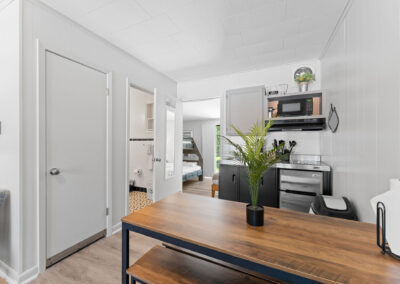 a kitchen with a table and chairs in it