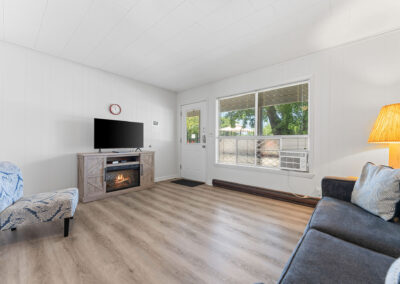 a living room filled with furniture and a flat screen tv