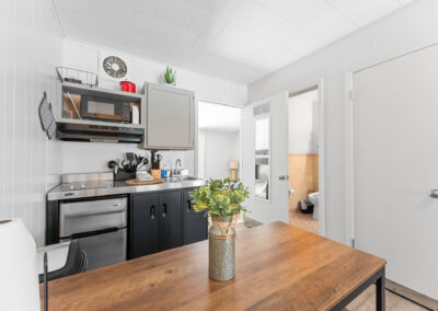 a kitchen with a wooden table in it
