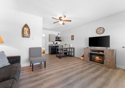 a living room filled with furniture and a flat screen tv