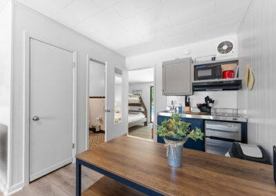 a kitchen with a table and chairs in it
