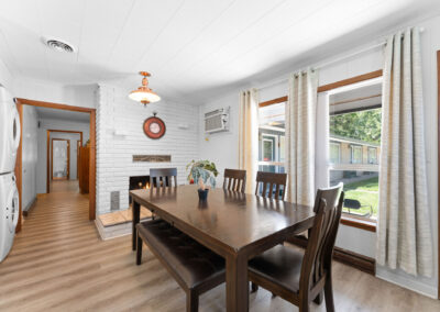 a dining room with a table and chairs