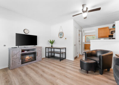 a living room filled with furniture and a flat screen tv
