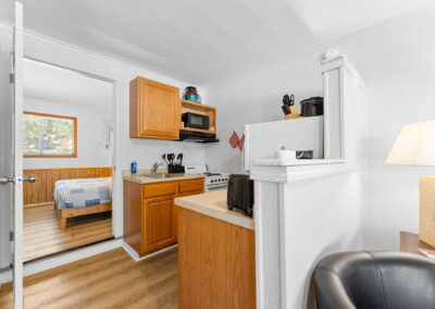 a kitchen and living room in a small home