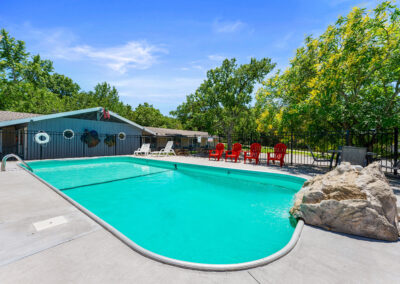 a pool with a rock in the middle of it