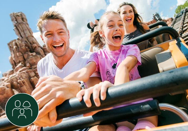 a group of people riding on top of a roller coaster